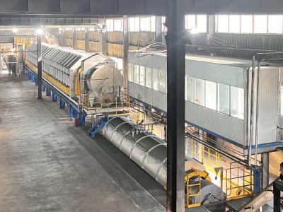 Continuous cladding granulation pre-carbonisation rotary kiln